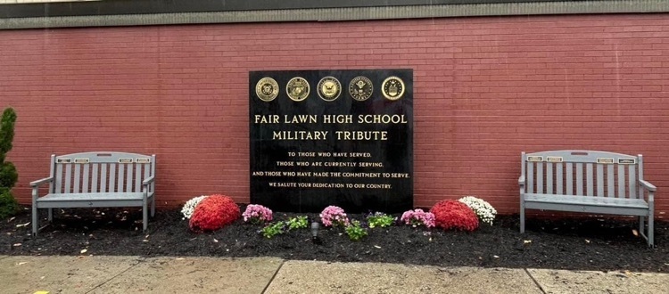 Military monument in front of high school 