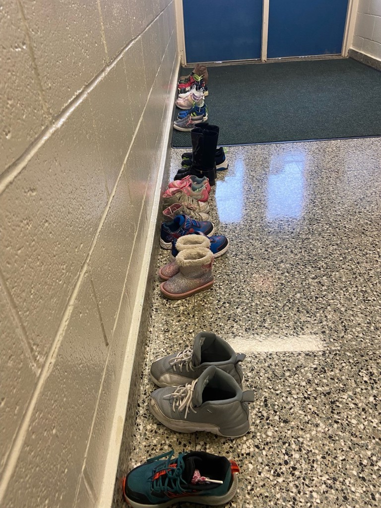student shoes lined up in the school's hallway