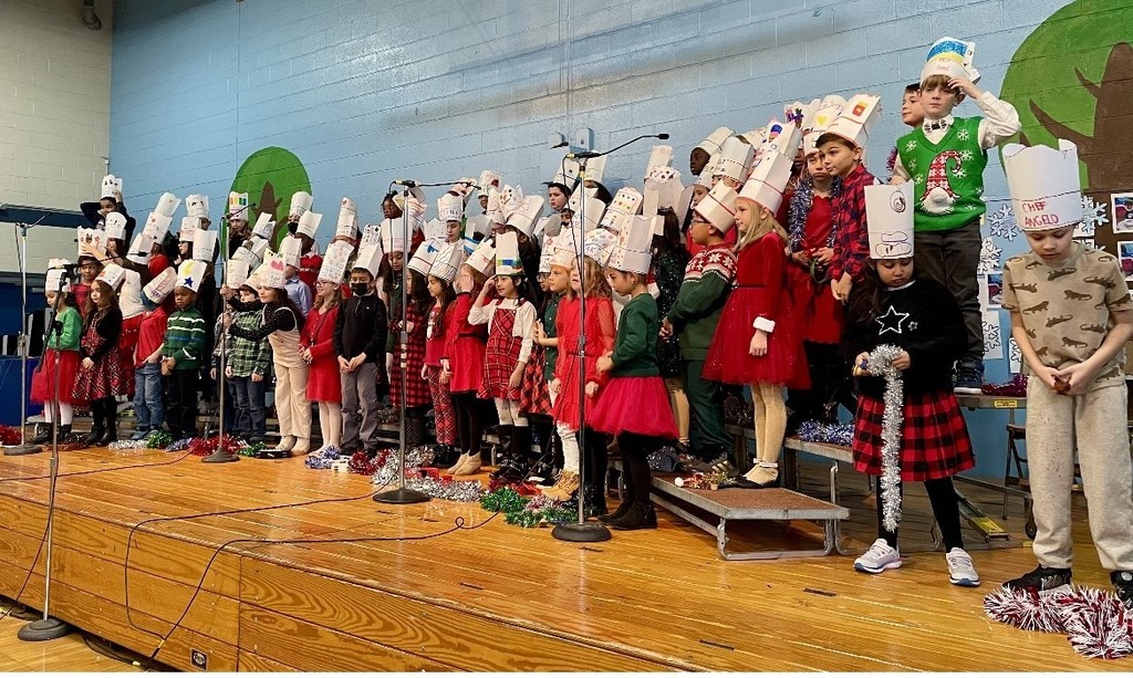 third grade classes singing at the holiday concert