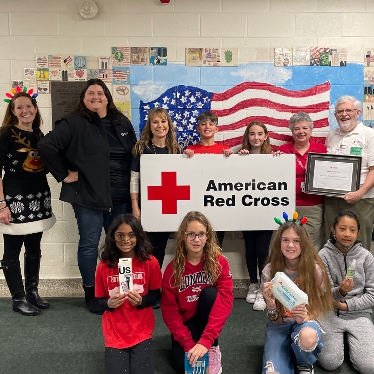 Grade 5 and 6 students stand with volunteers from the American Red Cross who took time out of their day to spend the day with Memorial students and staff. 