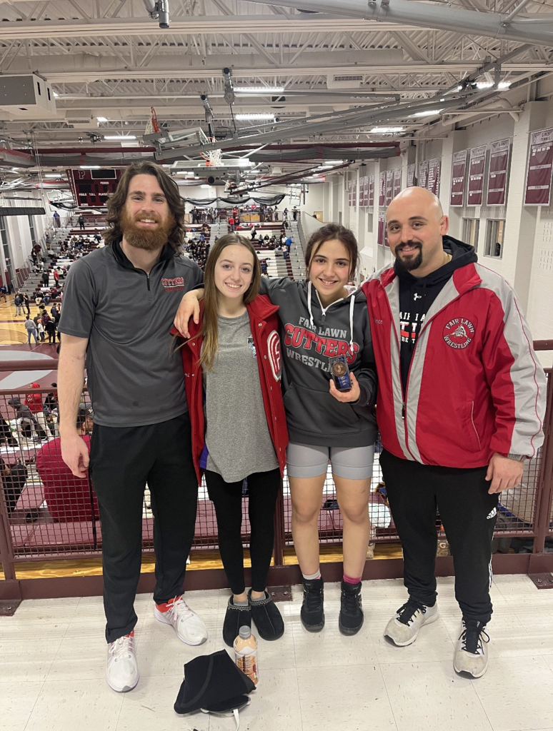 student with coaches