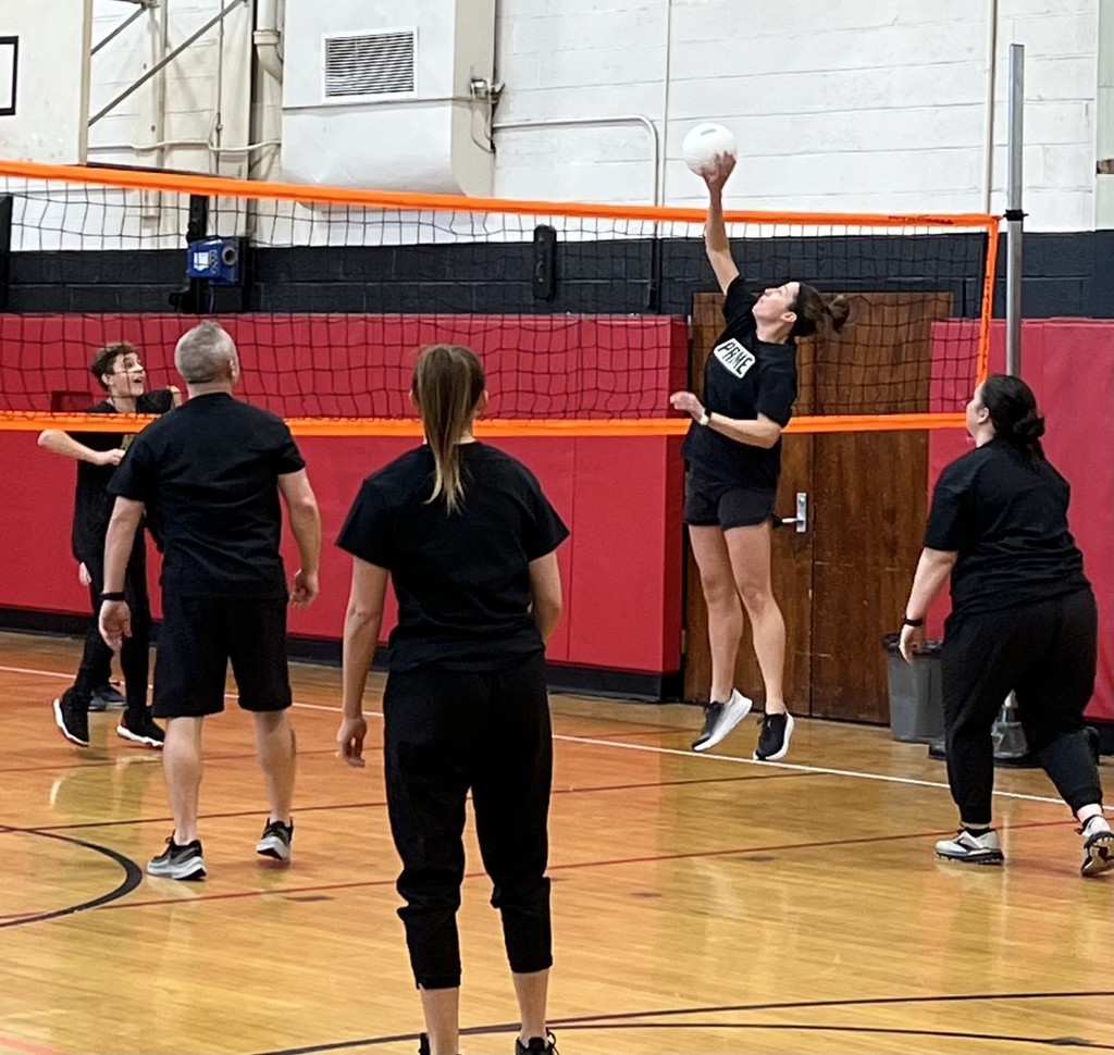 staff playing volleyball