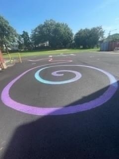 blacktop with purple and blue swirls painted on it